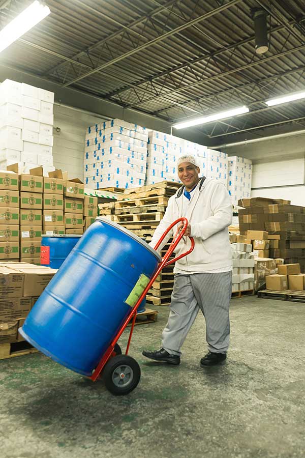 Hand truck being used to haul heavy item